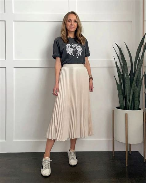 wearing pleated skirt with sneakers.